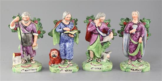 A set of four Staffordshire Pearlware figures of Saints, by Salt, 18.5 - 19cm, some restoration